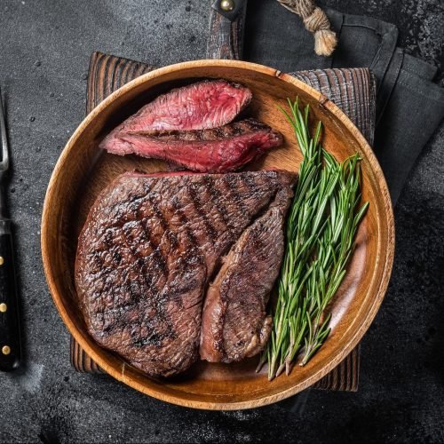 bbq-grilled-medium-rare-top-sirloin-beef-steak-rump-steak-in-a-wooden-plate-e1664111691605