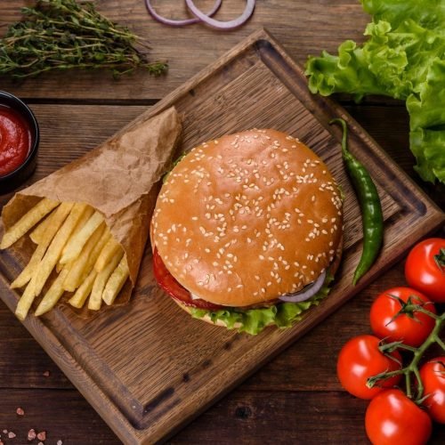 craft-beef-burger-and-french-fries-on-a-black-background-e1664111539632